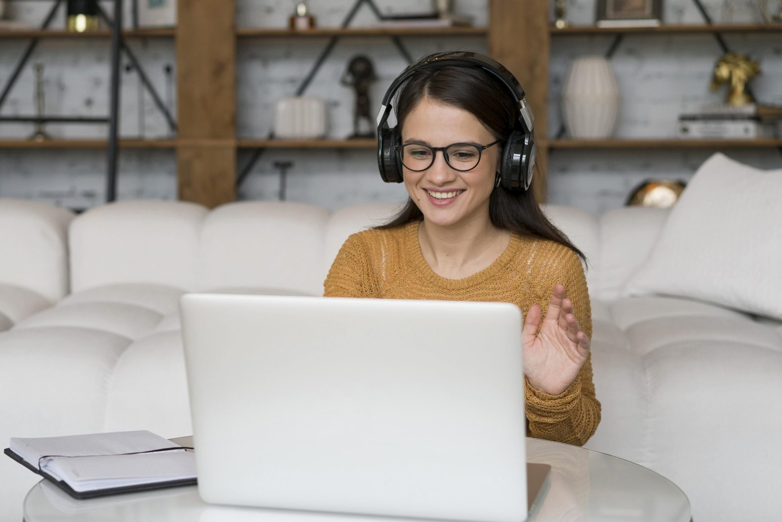 Online Teaching Resources – Teacher conducting an interactive online class using a laptop and headset