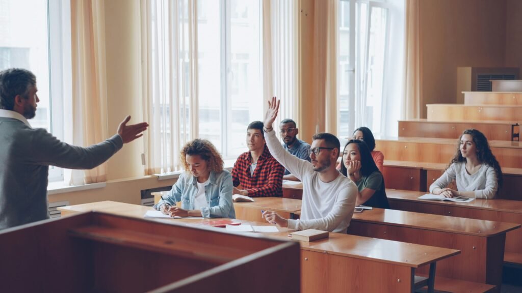 Classroom management tips in action as a teacher engages students in an organized classroom discussion with active participation.